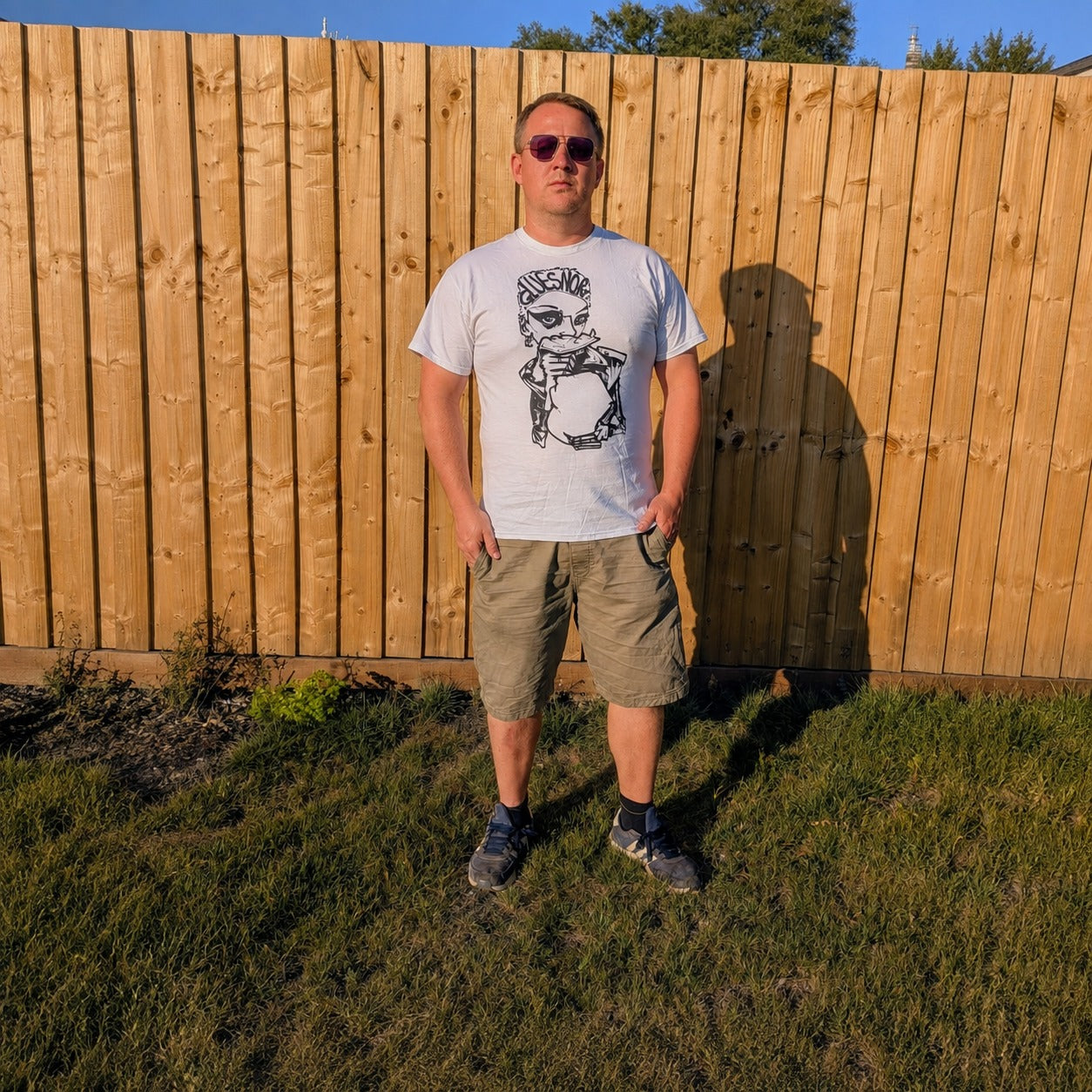 Model wearing Gluesnort Festival Tee (black on white) by Wrongpop